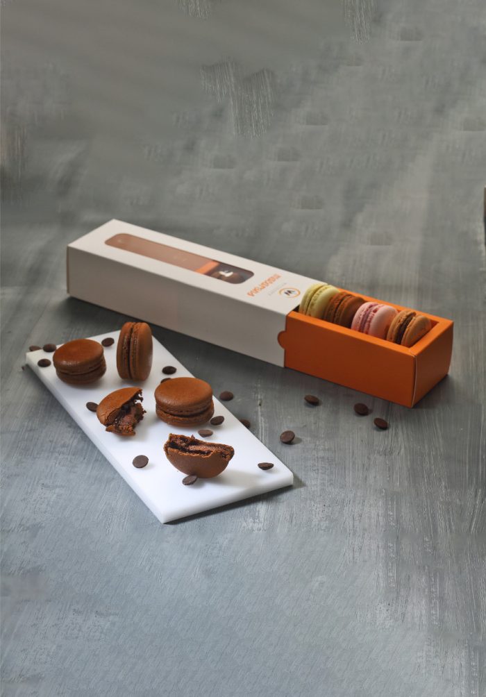 Elegant dark chocolate Classic French macarons stacked together