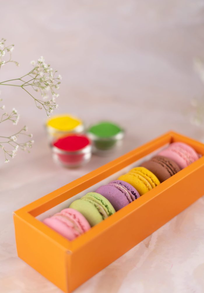 Display of Classic French macarons with silky pastry cream fillings